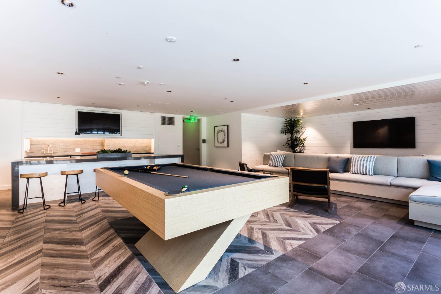 1000 3rd Street, Unit 806 San Francisco, CA 94158 - Photo 15 of 28 a living room with furniture and a flat screen tv