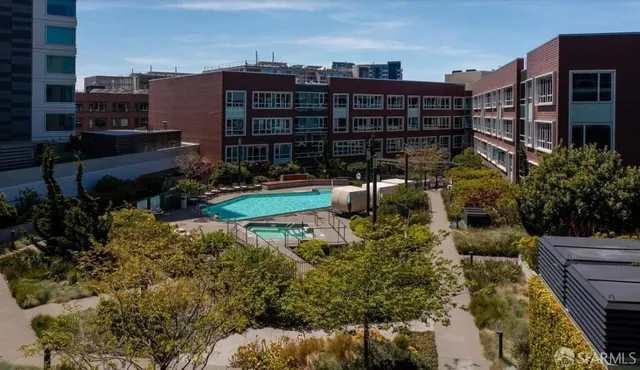 a view of city from balcony with furniture
