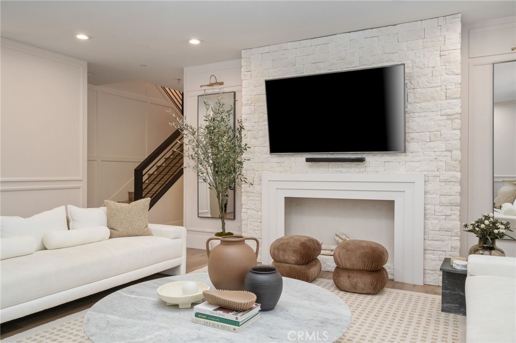 5726 Nova Way Riverside, CA 92505 - Photo 1 of 1 a living room with furniture a flat screen tv and a fireplace