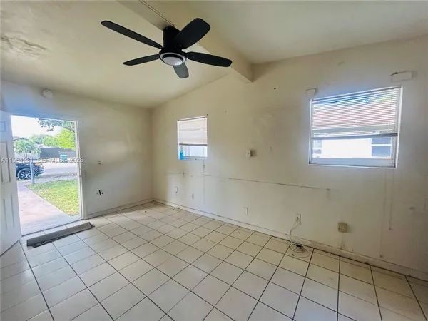 a view of an empty room and window