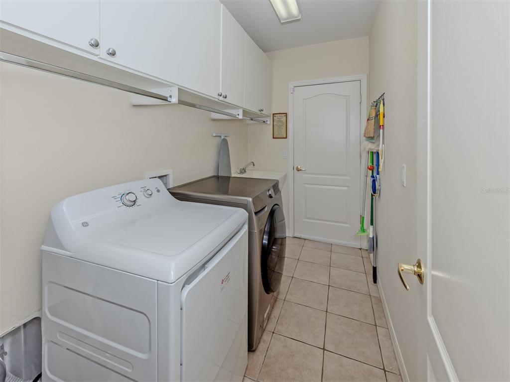 205 Reclinata Circle Venice, FL 34292 - Photo 31 of 62 a utility room with dryer and washer