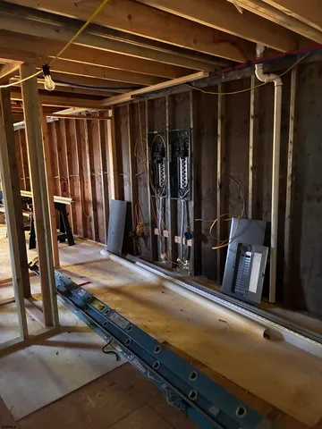a view of walk in closet with clothes