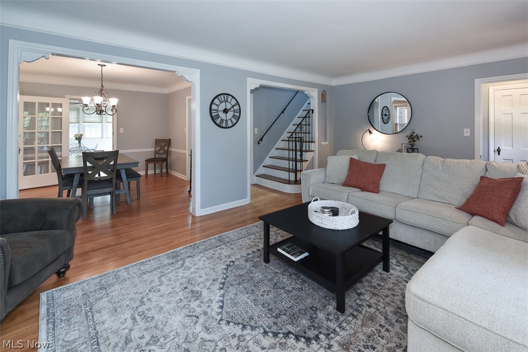 2559 Channing Road Cleveland, OH 44118 - Photo 2 of 28 Living room featuring hardwood / wood-style flooring, a chandelier, and ornamental molding