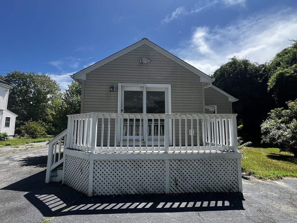 703 Mill Street Marion, MA 02738 - Photo 3 of 16 a view of a house with a deck