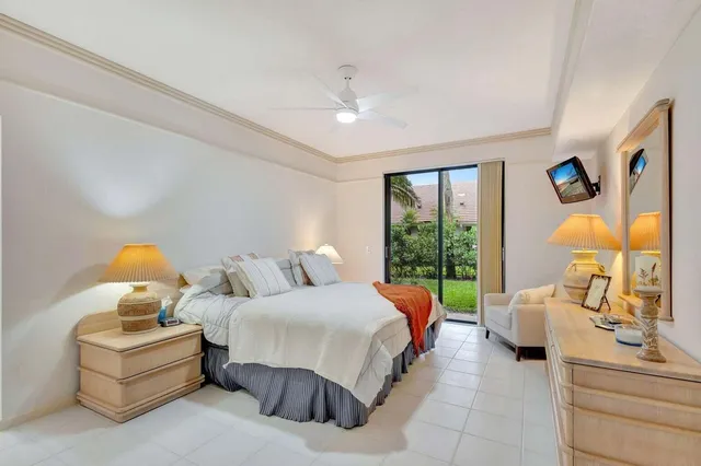 a bedroom with bed and window