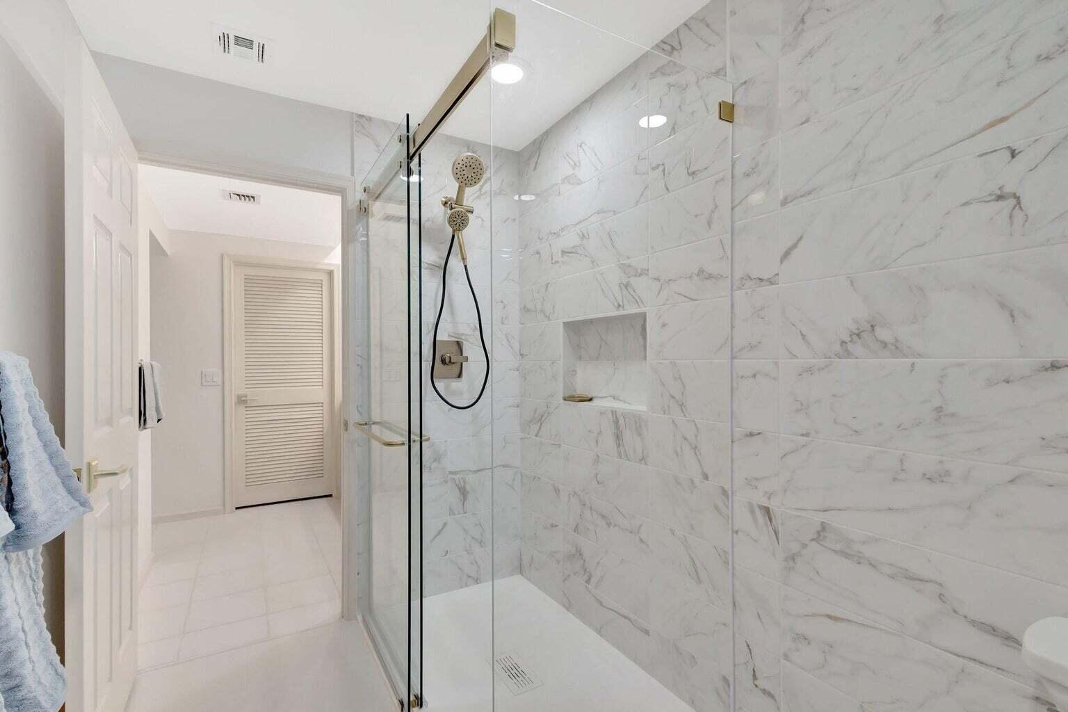 16151 West Bay Drive, Unit 161 Jupiter, FL 33477 - Photo 18 of 25 a bathroom with a shower