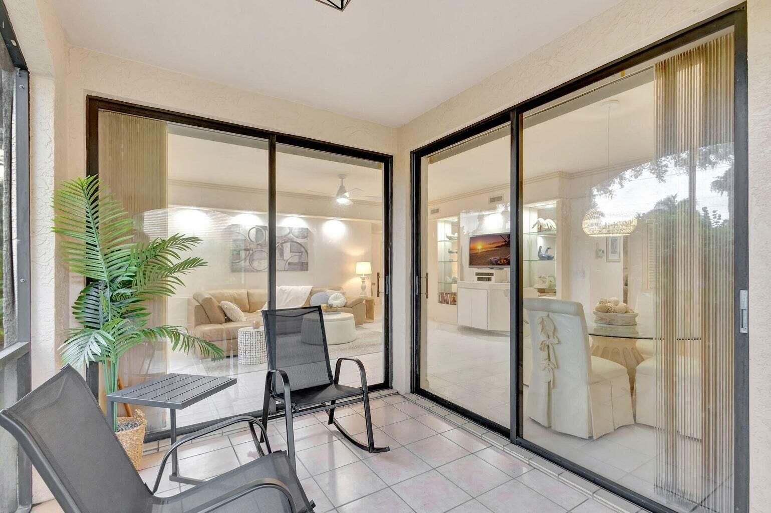16151 West Bay Drive, Unit 161 Jupiter, FL 33477 - Photo 23 of 25 a view of a livingroom with furniture and a window