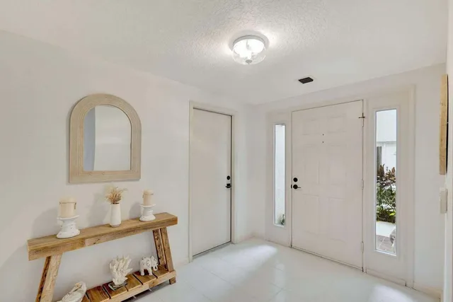 a view of room with furniture and wooden floor