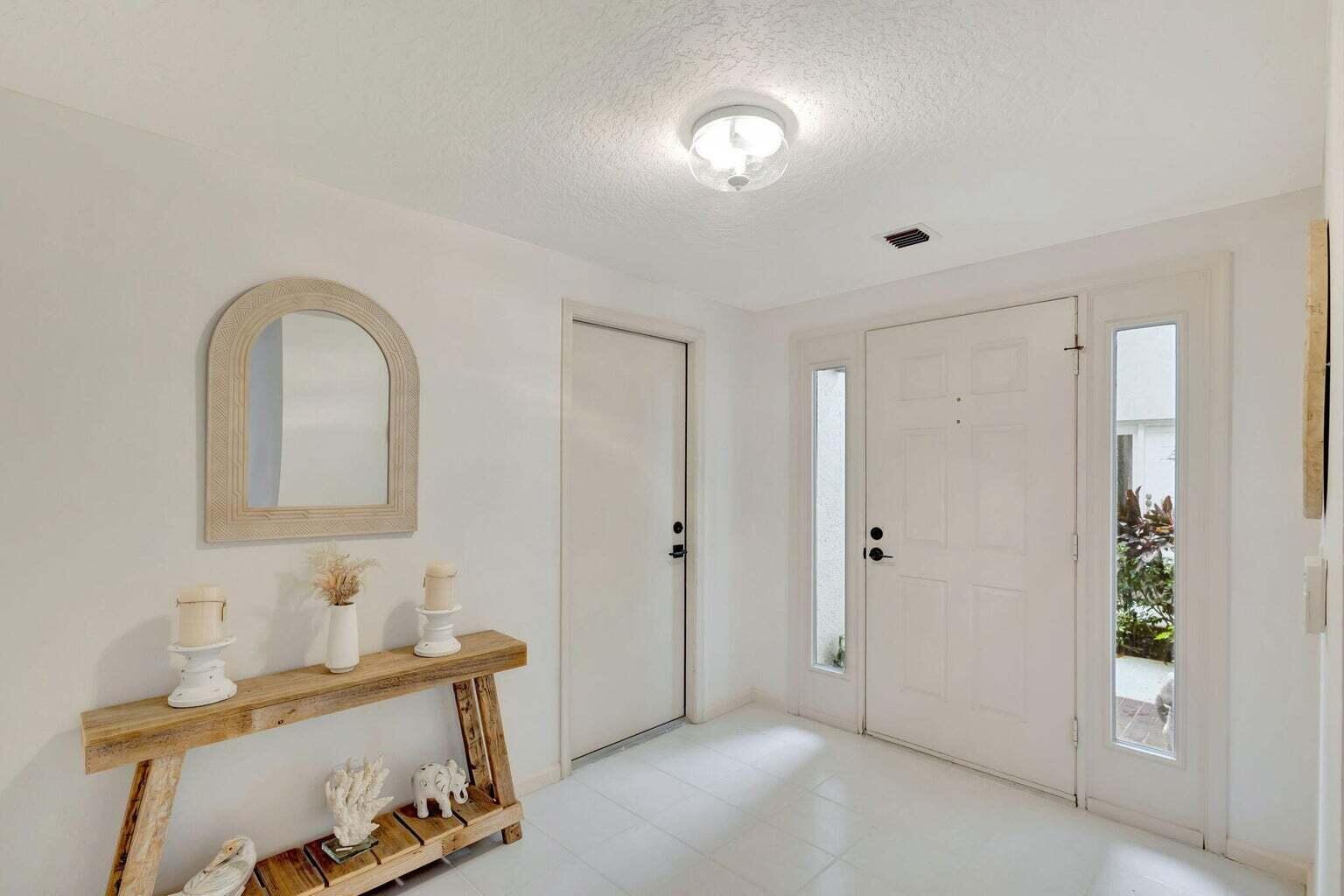 16151 West Bay Drive, Unit 161 Jupiter, FL 33477 - Photo 6 of 25 a view of room with furniture and wooden floor