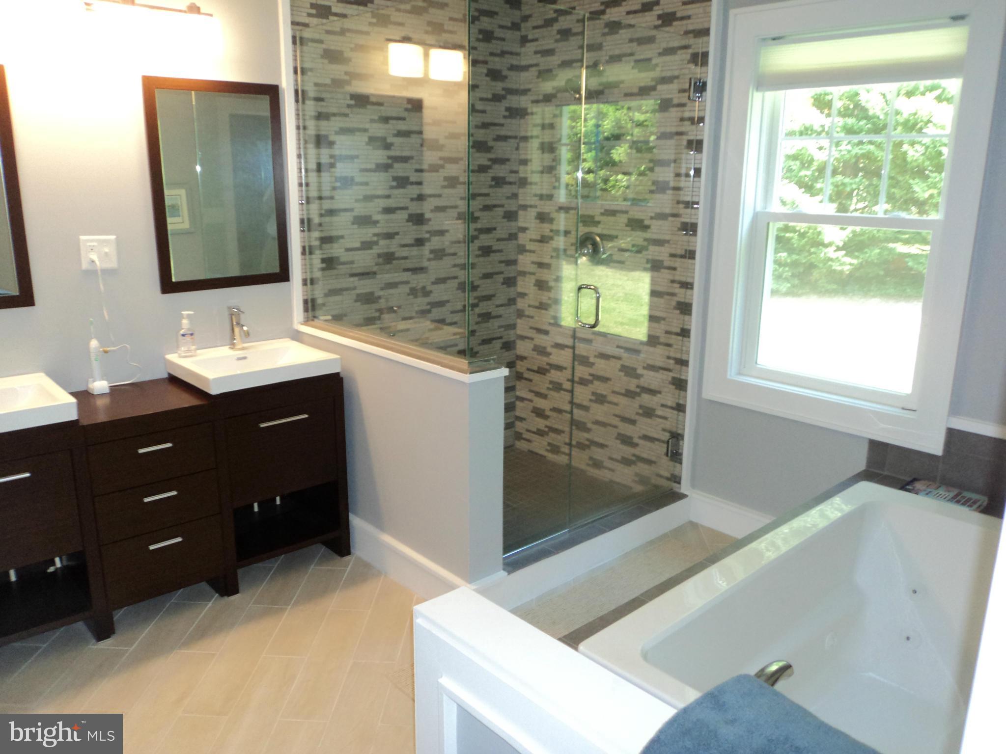6871 Edge Creek Road St. Michaels, MD 21663 - Photo 18 of 26 a bathroom with a sink and a mirror