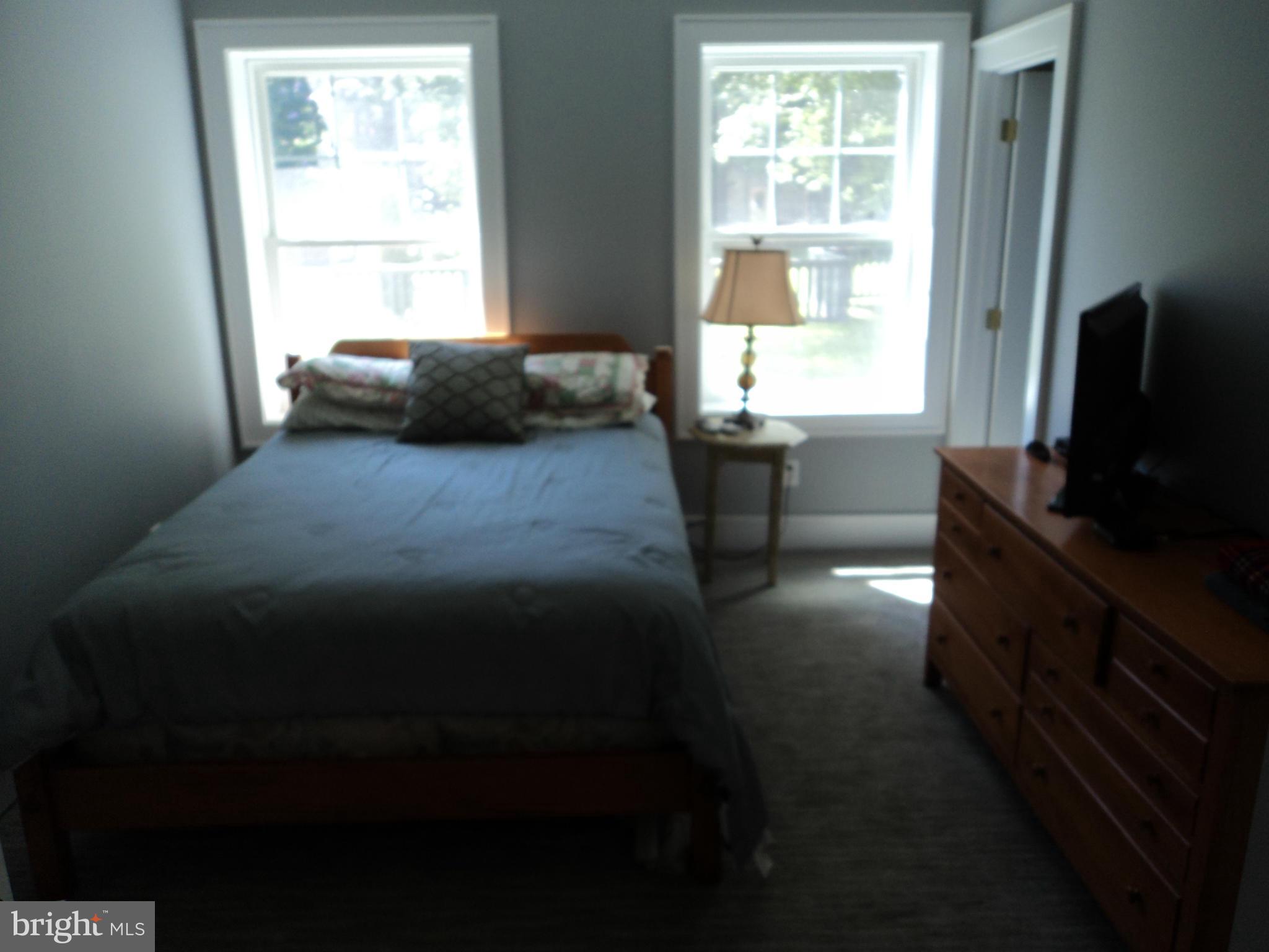 6871 Edge Creek Road St. Michaels, MD 21663 - Photo 20 of 26 a bedroom with a bed and a window