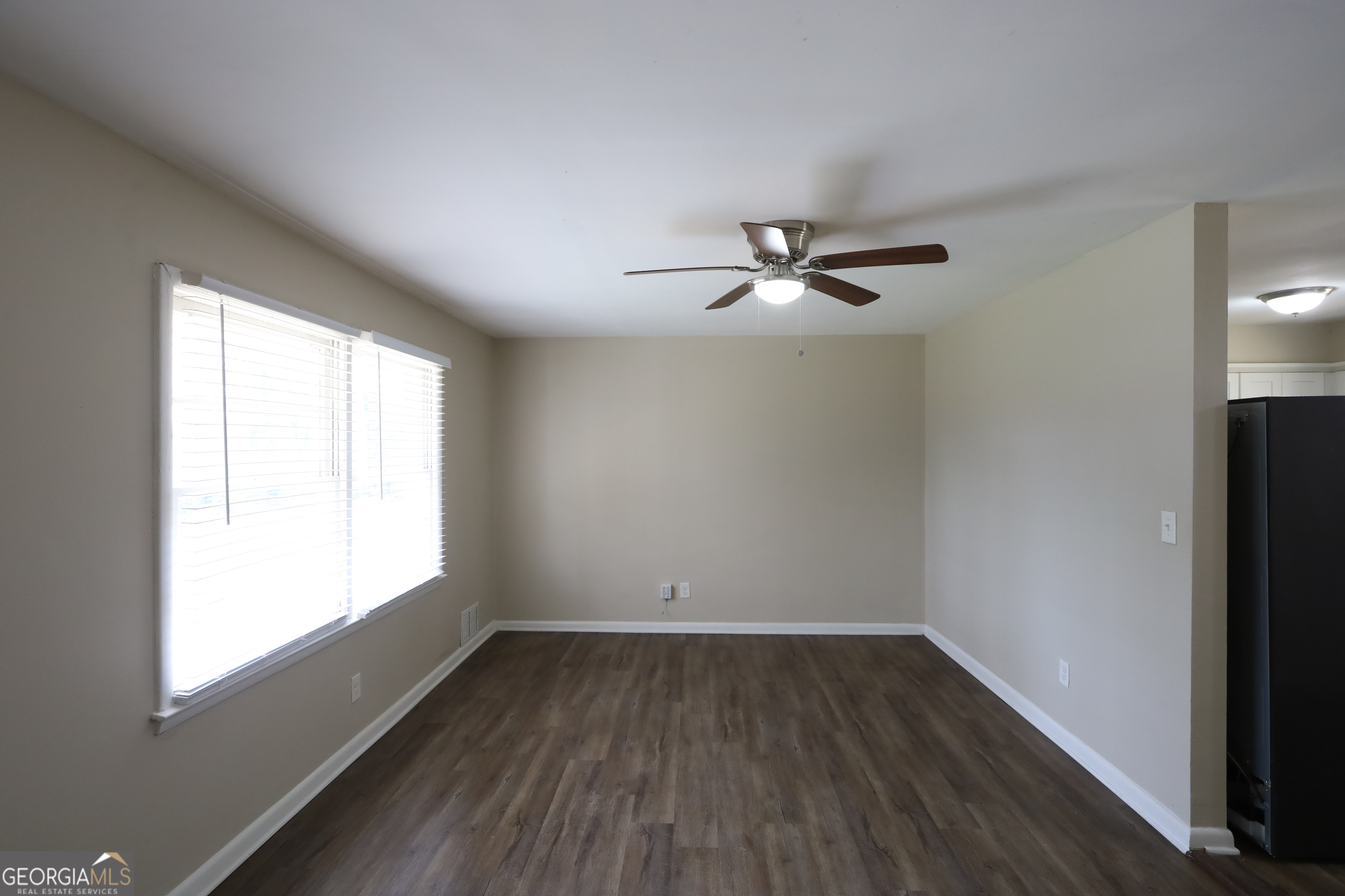 1751 Woodsloe Drive Decatur, GA 30035 - Photo 2 of 9 wooden floor in an empty room with a window