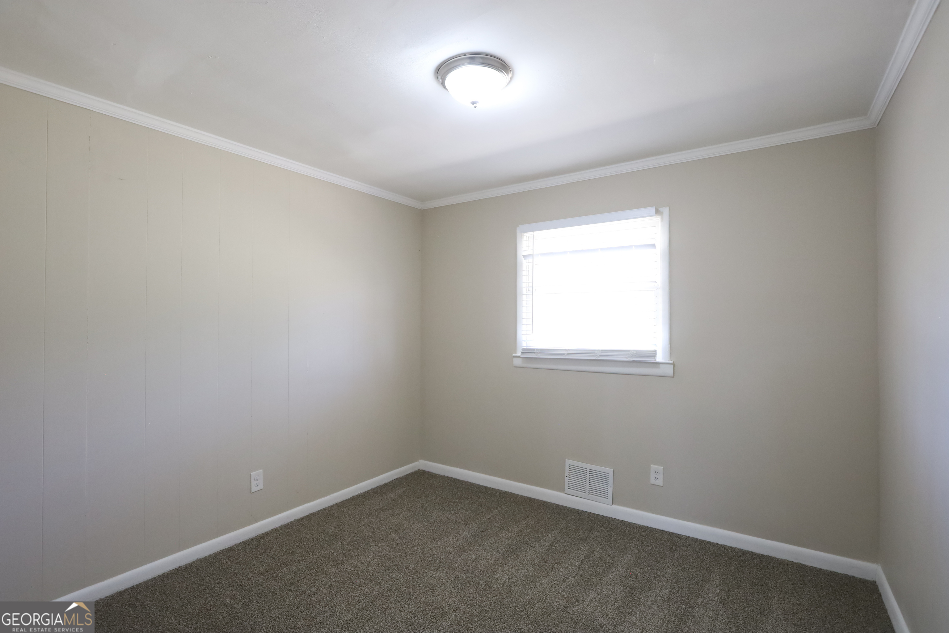 1751 Woodsloe Drive Decatur, GA 30035 - Photo 5 of 9 an empty room with a window