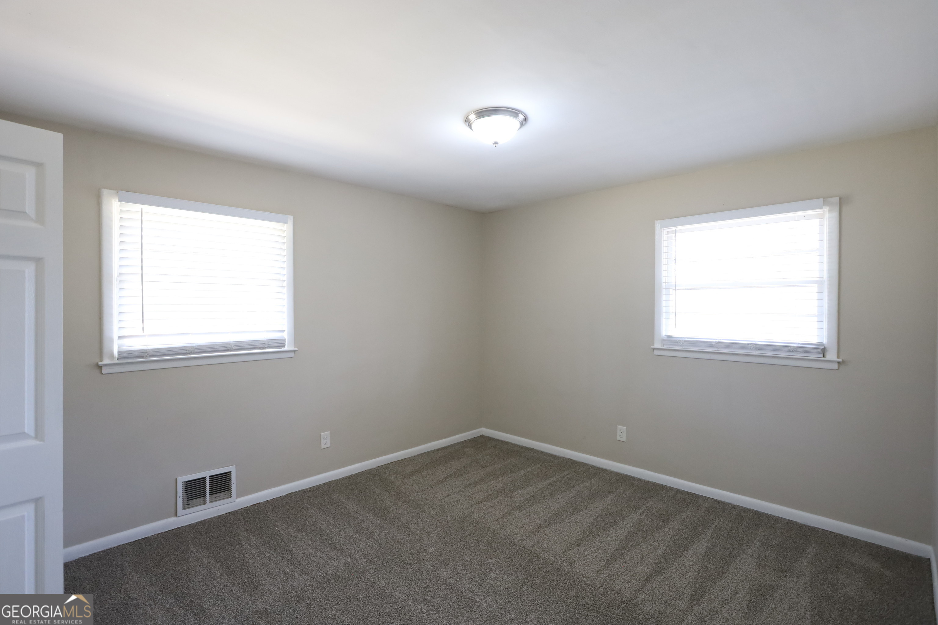 1751 Woodsloe Drive Decatur, GA 30035 - Photo 6 of 9 an empty room with a window