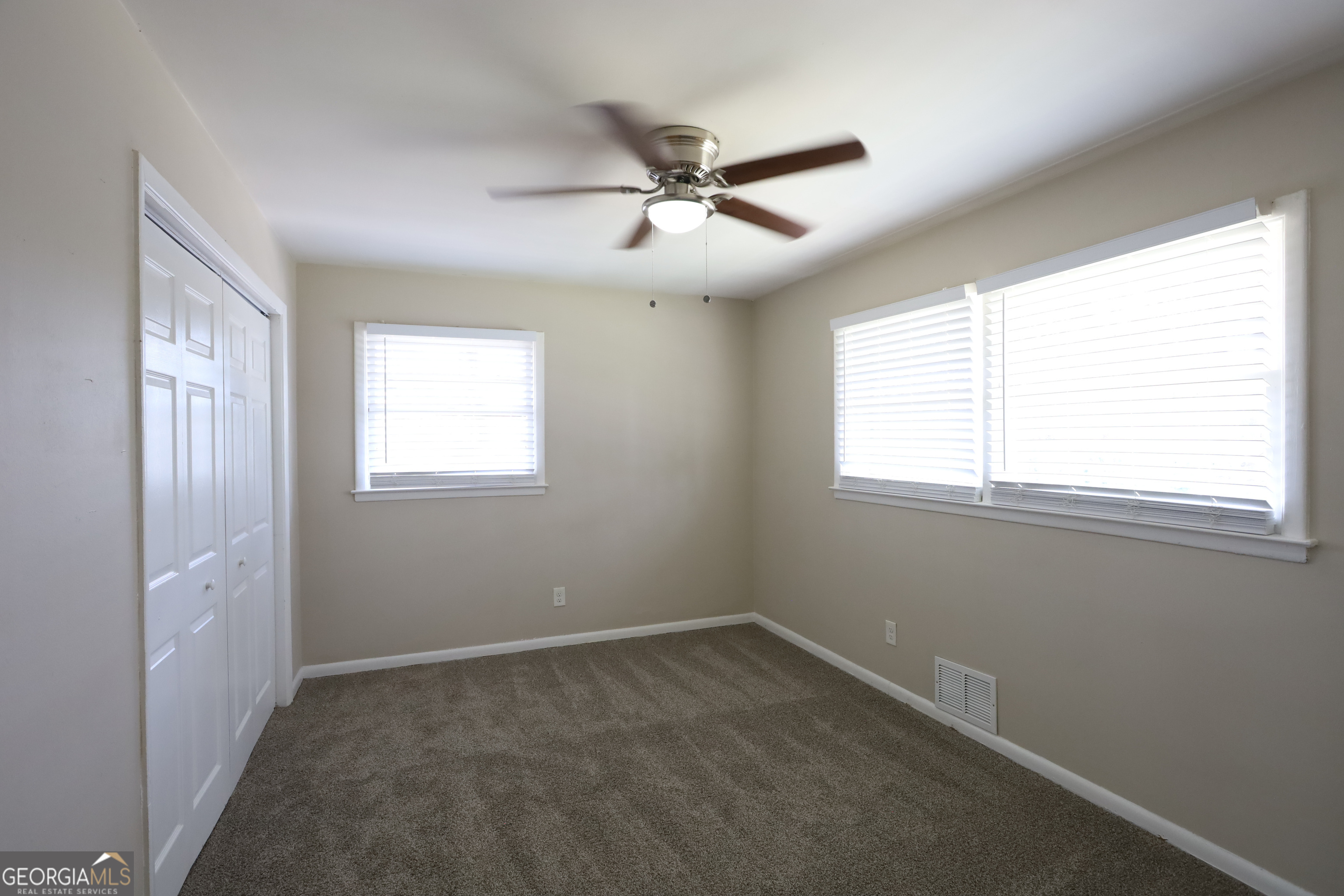 1751 Woodsloe Drive Decatur, GA 30035 - Photo 8 of 9 a view of a livingroom with a ceiling fan and window
