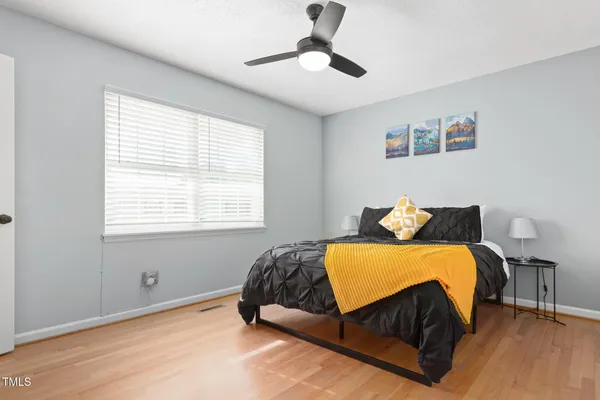 a bedroom with a bed and window