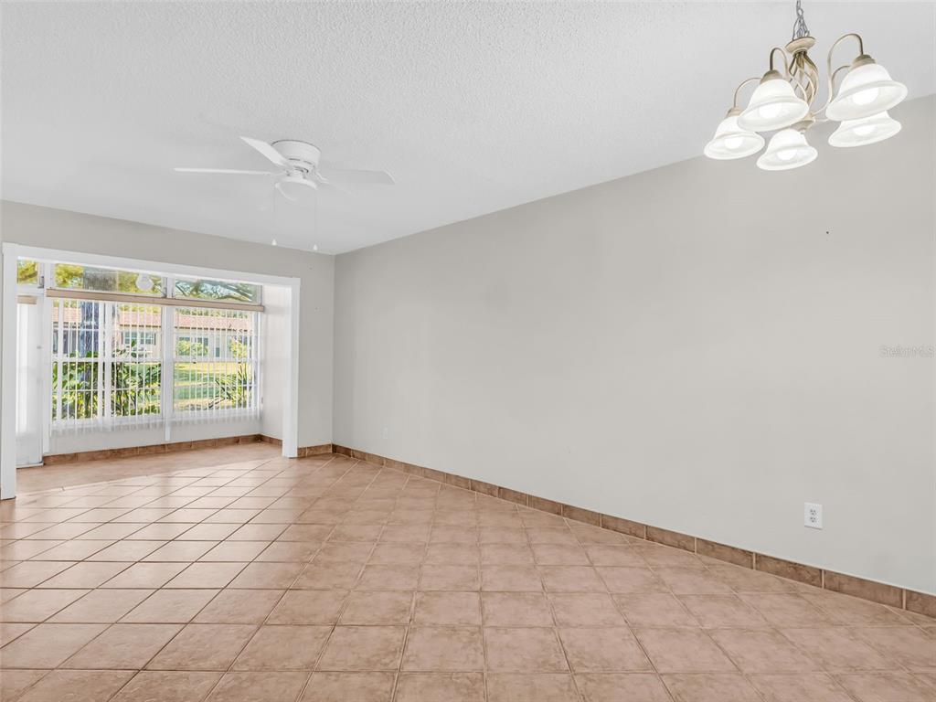 3109 Mission Grove Drive, Unit D Palm Harbor, FL 34684 - Photo 12 of 62 a view of an empty room with a window