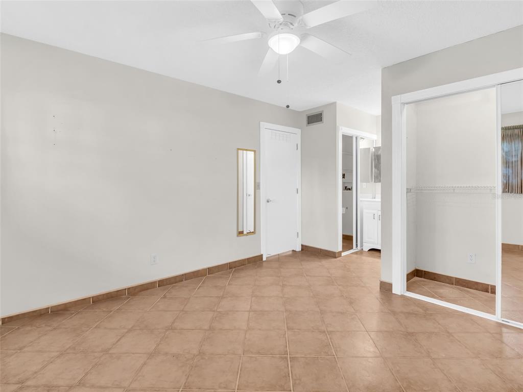 3109 Mission Grove Drive, Unit D Palm Harbor, FL 34684 - Photo 14 of 62 a view of an empty room with a window