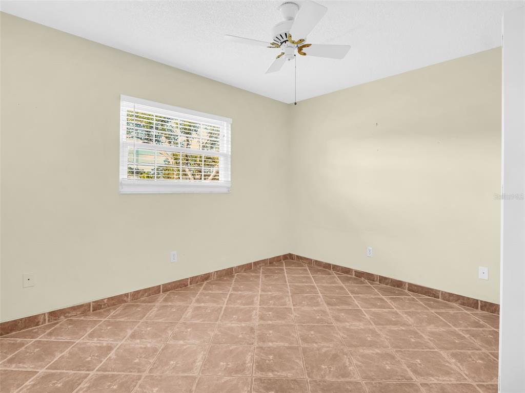 3109 Mission Grove Drive, Unit D Palm Harbor, FL 34684 - Photo 20 of 62 a view of an empty room with a window