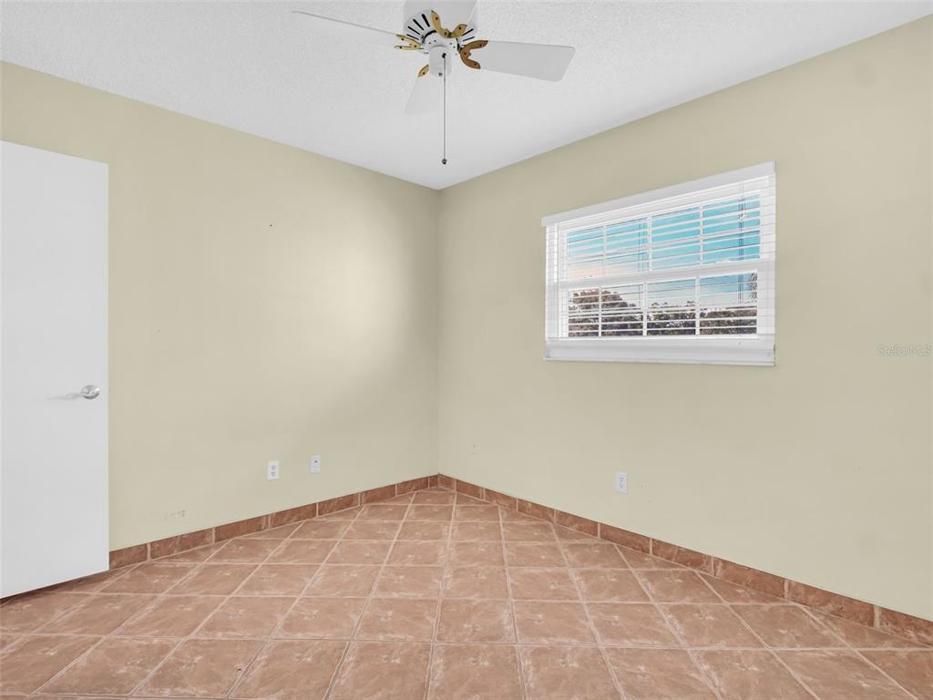 3109 Mission Grove Drive, Unit D Palm Harbor, FL 34684 - Photo 24 of 62 a view of an empty room with a window