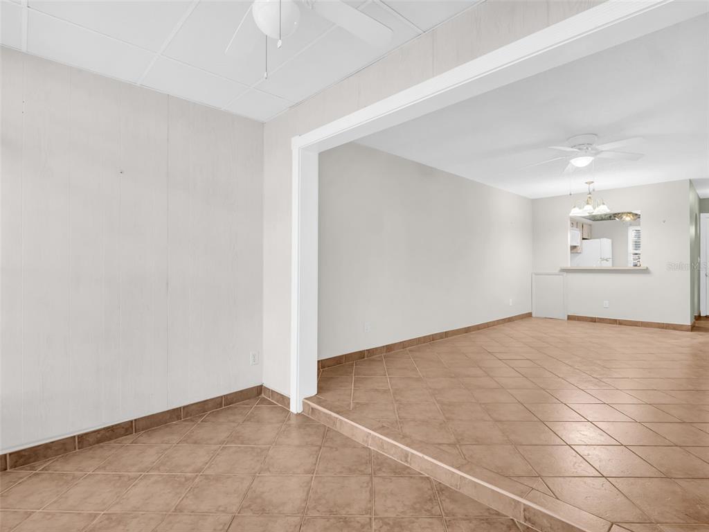 3109 Mission Grove Drive, Unit D Palm Harbor, FL 34684 - Photo 30 of 62 an empty room with a empty space and windows