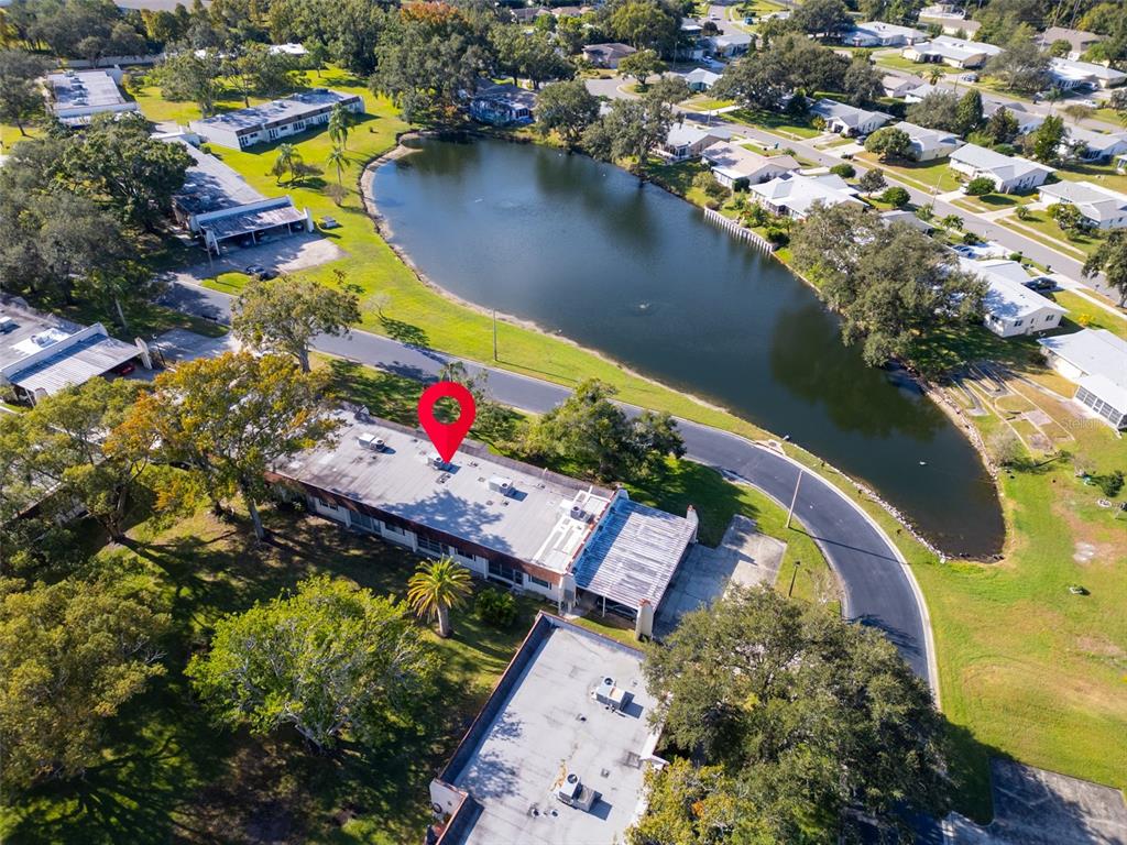 3109 Mission Grove Drive, Unit D Palm Harbor, FL 34684 - Photo 34 of 62 an aerial view of residential houses with outdoor space