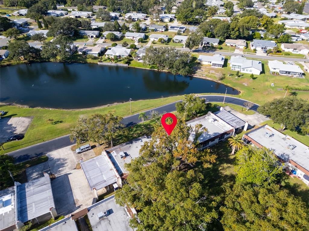 3109 Mission Grove Drive, Unit D Palm Harbor, FL 34684 - Photo 35 of 62 an aerial view of a house with a lake view