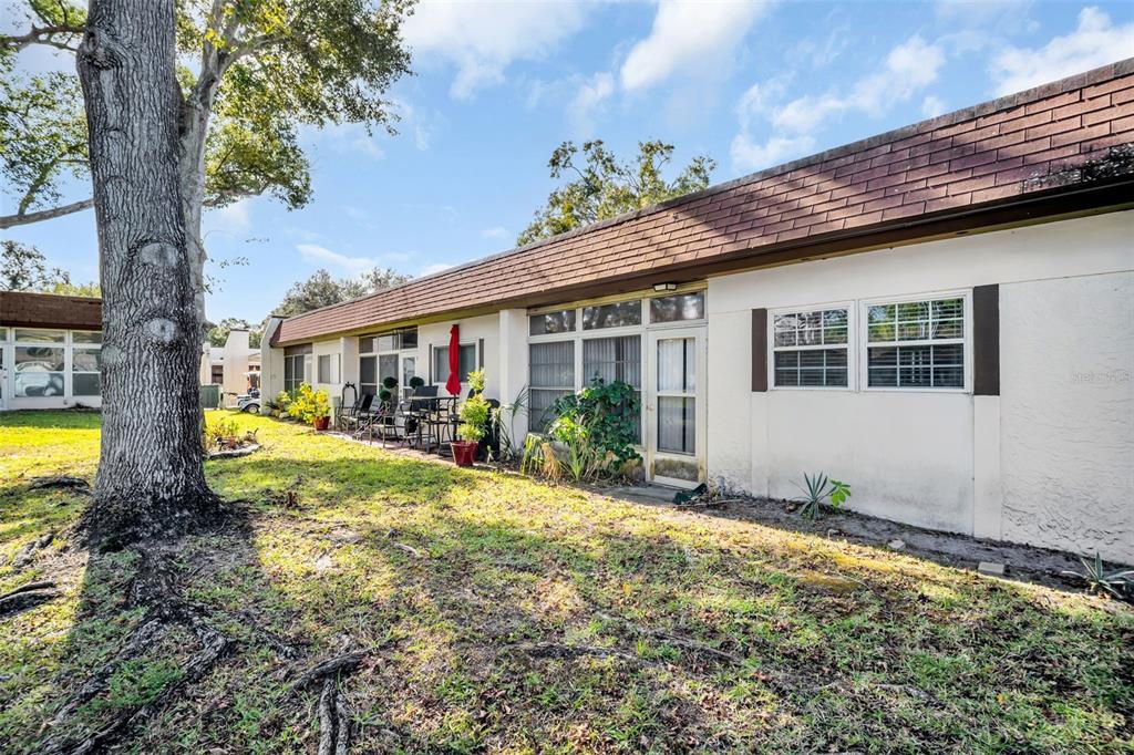 3109 Mission Grove Drive, Unit D Palm Harbor, FL 34684 - Photo 41 of 62 a view of house with swimming pool outdoor seating
