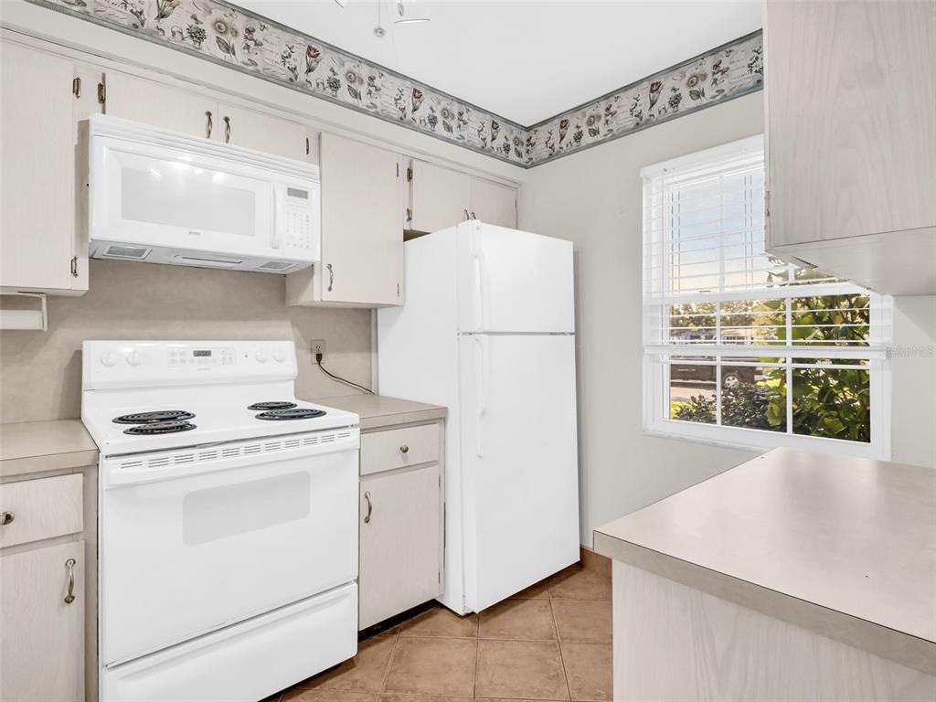 3109 Mission Grove Drive, Unit D Palm Harbor, FL 34684 - Photo 9 of 62 a utility room with dryer and washer