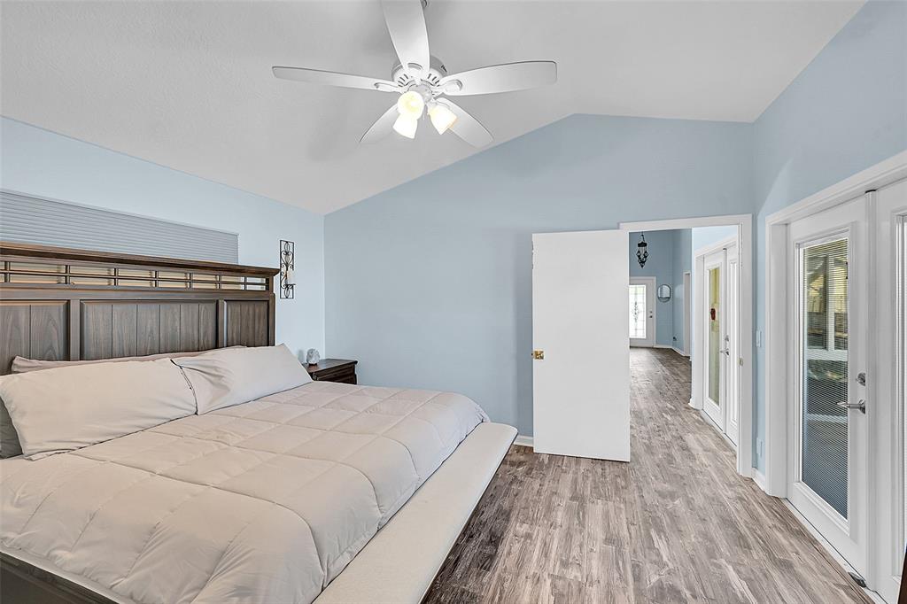 22533 Swordfish Drive Boca Raton, FL 33428 - Photo 18 of 49 a bedroom with a bed and a chandelier