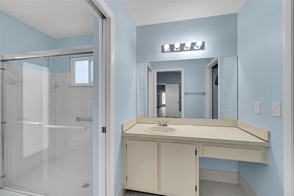 22533 Swordfish Drive Boca Raton, FL 33428 - Photo 22 of 49 a bathroom with a sink and a mirror