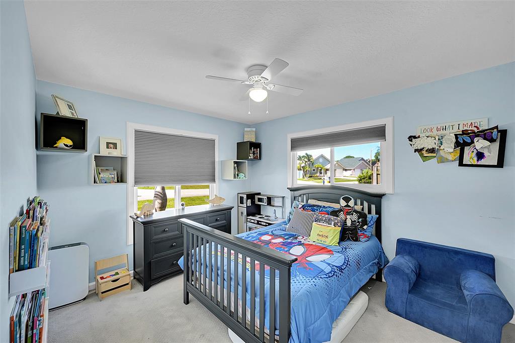 22533 Swordfish Drive Boca Raton, FL 33428 - Photo 24 of 49 a bedroom with furniture and a wooden floor