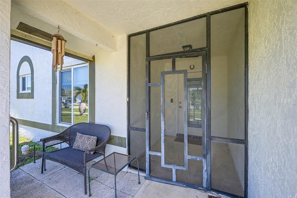 22533 Swordfish Drive Boca Raton, FL 33428 - Photo 3 of 49 a view of a hallway with furniture and a window