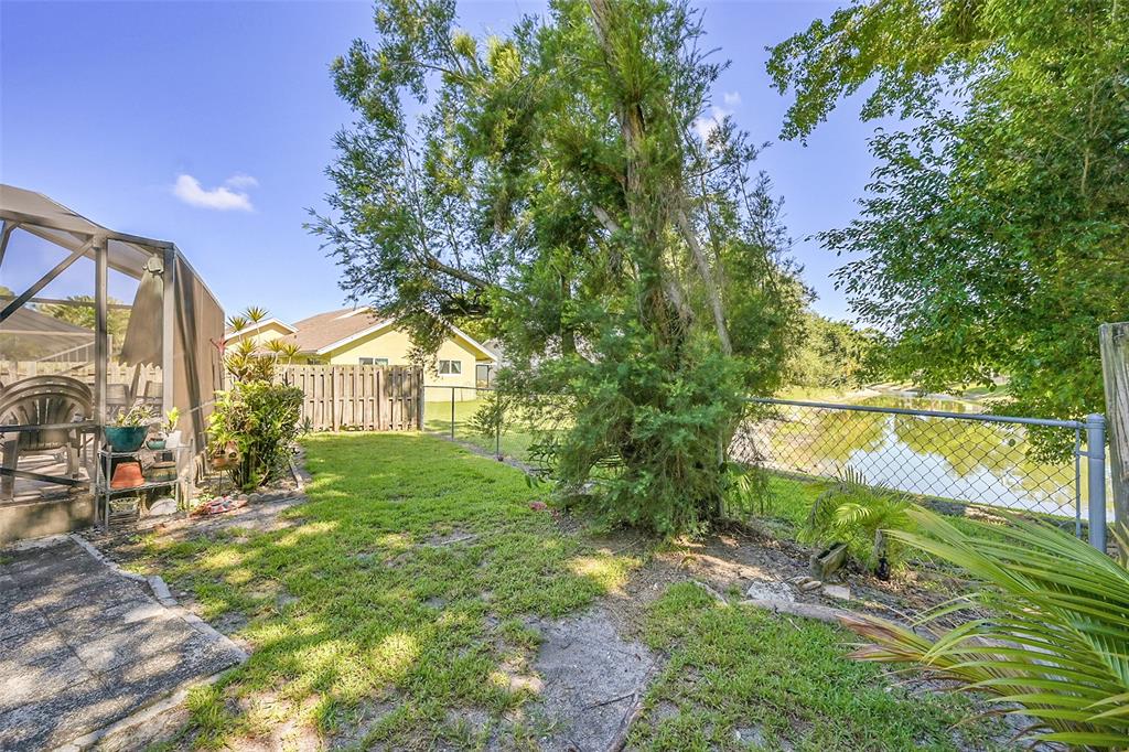 22533 Swordfish Drive Boca Raton, FL 33428 - Photo 33 of 49 a yellow house with trees in front of it