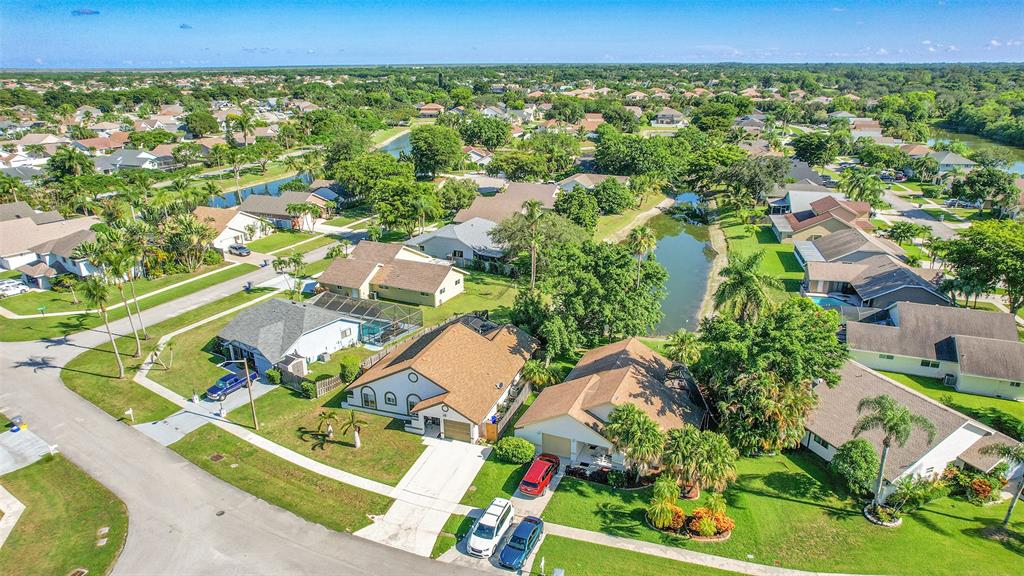 22533 Swordfish Drive Boca Raton, FL 33428 - Photo 37 of 49 an aerial view of a residential houses with outdoor space and street view