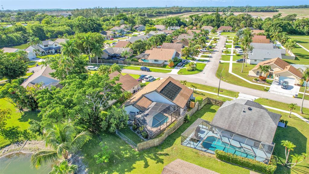 22533 Swordfish Drive Boca Raton, FL 33428 - Photo 40 of 49 an aerial view of residential houses with outdoor space and trees all around
