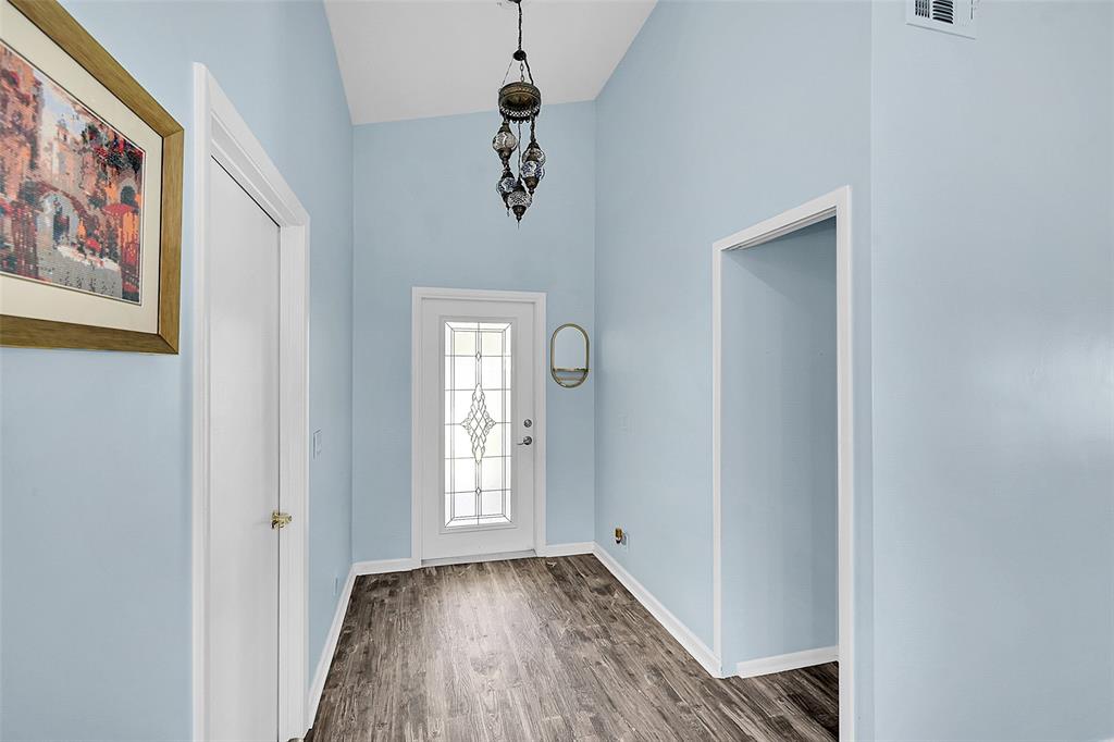 22533 Swordfish Drive Boca Raton, FL 33428 - Photo 4 of 49 a view of an entryway with wooden floor