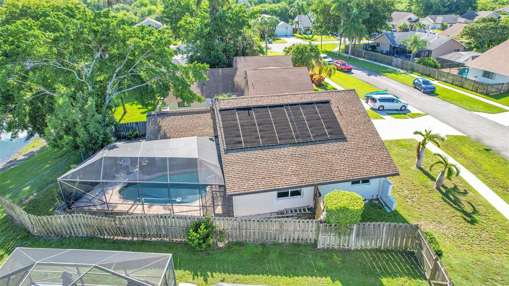 22533 Swordfish Drive Boca Raton, FL 33428 - Photo 42 of 49 an aerial view of a house with swimming pool and large trees
