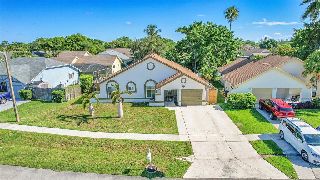 22533 Swordfish Drive Boca Raton, FL 33428 - Photo 44 of 49 a front view of house with yard and green space
