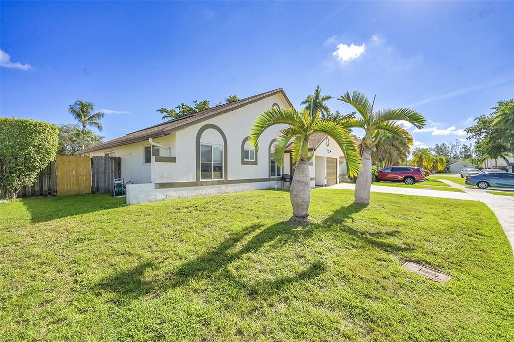 22533 Swordfish Drive Boca Raton, FL 33428 - Photo 45 of 49 a bathroom with a sink and mirror