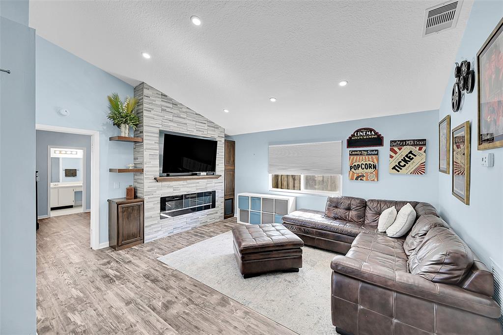 22533 Swordfish Drive Boca Raton, FL 33428 - Photo 5 of 49 a living room with furniture and a flat screen tv