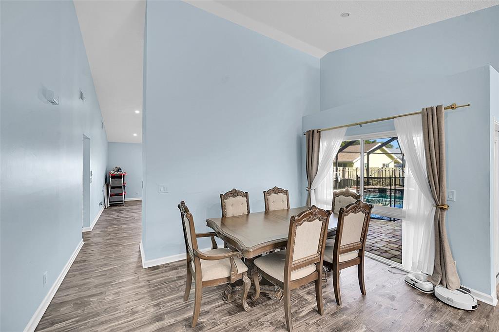 22533 Swordfish Drive Boca Raton, FL 33428 - Photo 9 of 49 a view of a dining room with furniture window and wooden floor