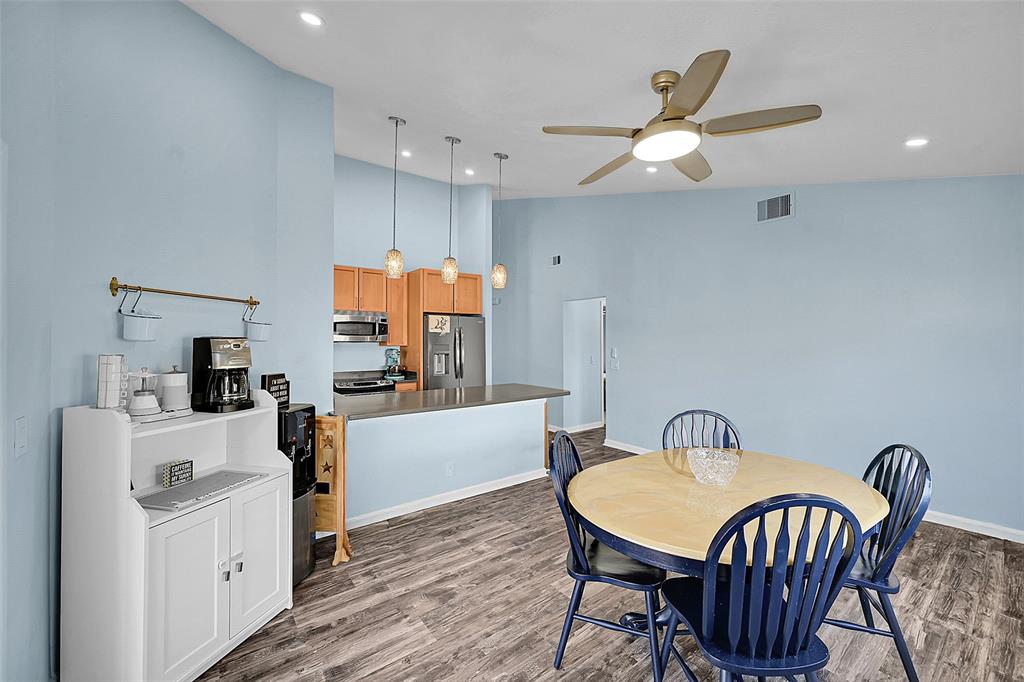 22533 Swordfish Drive Boca Raton, FL 33428 - Photo 10 of 49 a view of a dining room with furniture window and wooden floor