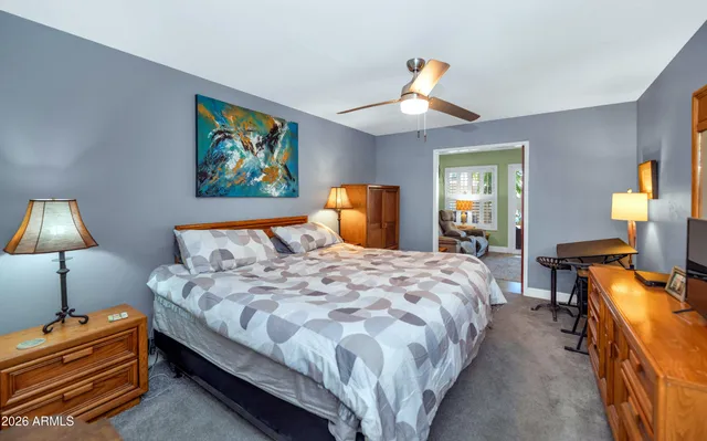 a bedroom with bed and window