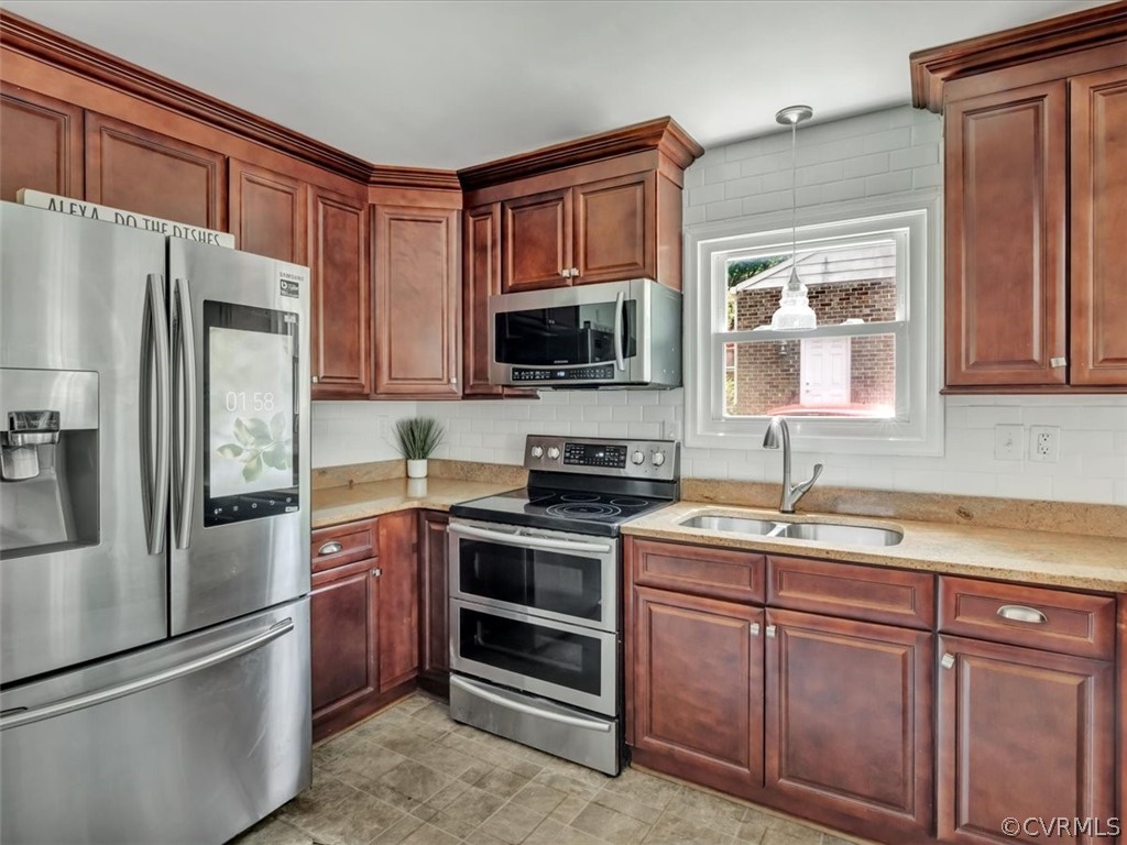 9501 Krause Road Chesterfield, VA 23832 - Photo 7 of 28 a kitchen with a sink stove and refrigerator