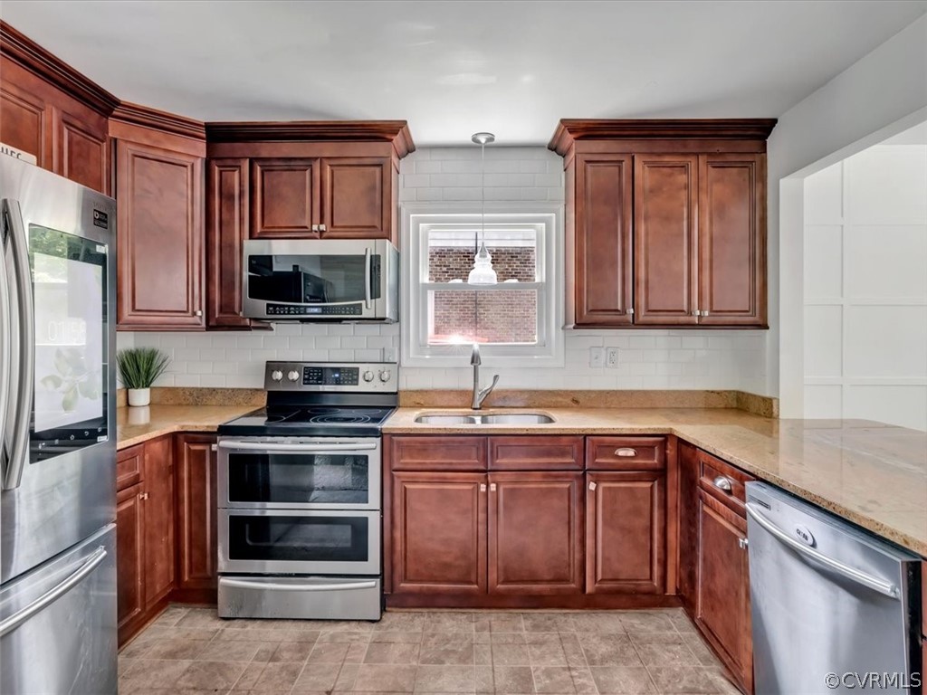9501 Krause Road Chesterfield, VA 23832 - Photo 8 of 28 a kitchen with stainless steel appliances granite countertop a stove microwave and sink