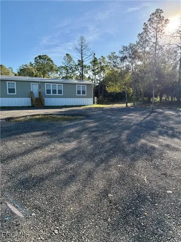 a view of house with outdoor space