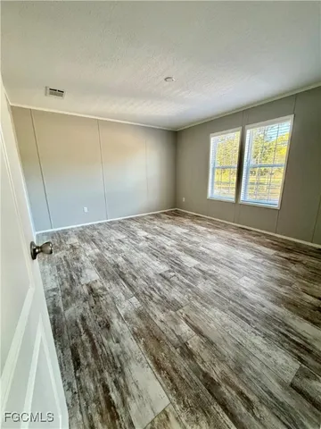 a view of an empty room and window