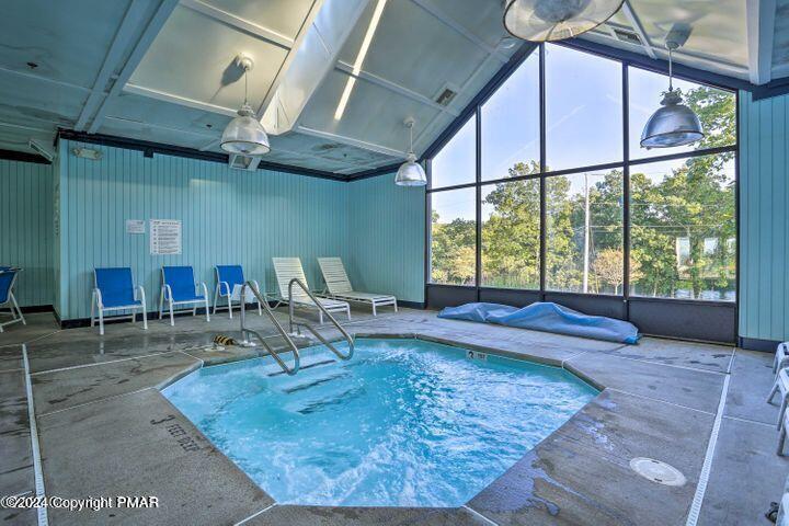 6414 Decker Road Bushkill, PA 18324 - Photo 50 of 65 a room with lots of furniture and a large window