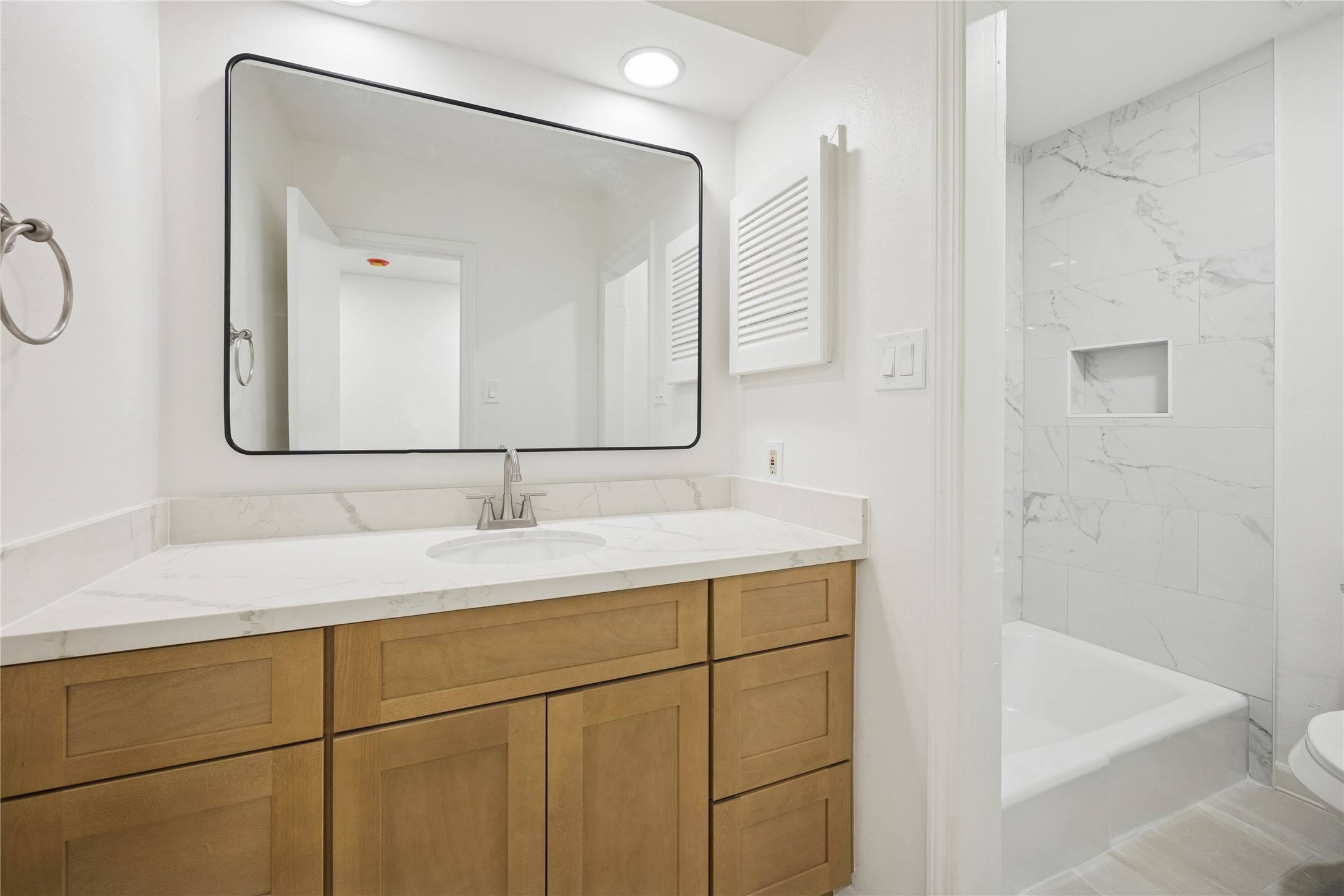 705 Harold Street, Unit 1 Houston, TX 77006 - Photo 13 of 16 a bathroom with a sink and a mirror